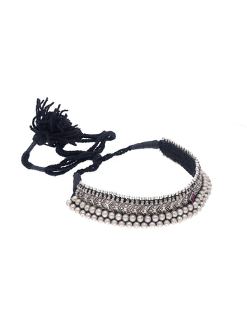 Ornate Silver Choker with Intricate Beads and a Gemstone Accent